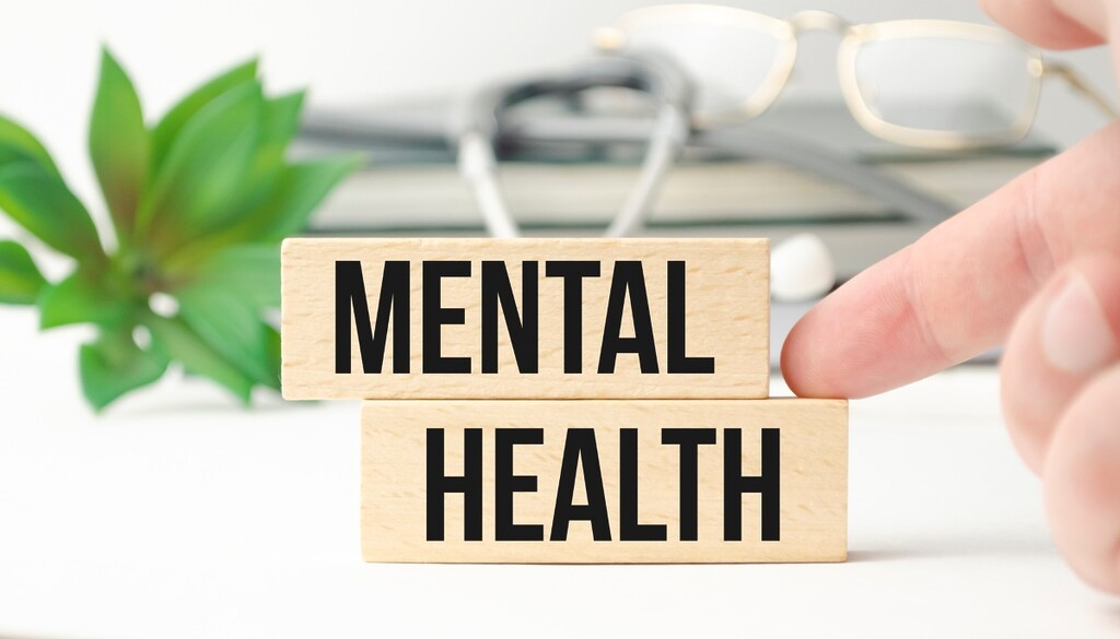 words mental health on small wooden blocks